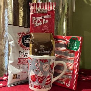 Harry & David ground coffee, peppermint bark, popcorn and spoons in ceramic mug.